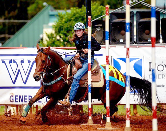 Barrel racer using Equi-Tape to support the horses sacroiliac joints. 